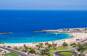 Playa de Amadores på Gran Canaria med hvid sandstrand og turkisblå bugt.